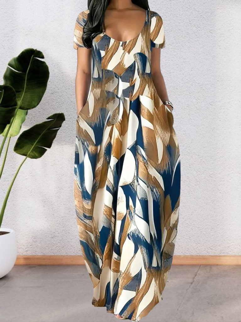 33ece192e9ee26d1d12d5cdb6bda57a8_22266-0.jpeg Kadın Kısa Kollu Yuvarlak Yaka Cepli Salaş Baskılı Süprem Elbise - Görsel 1